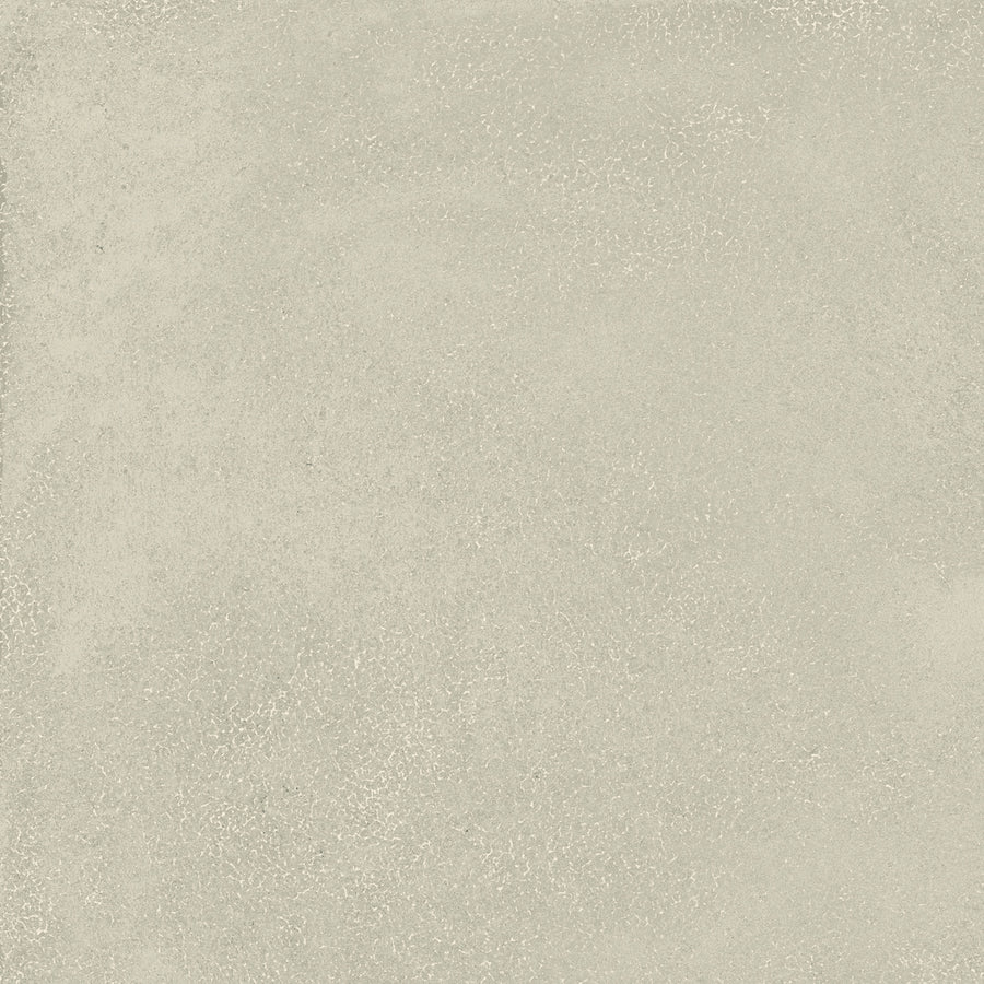The Avanti 12x12 Glazed Porcelain Tile features a light gray, subtly mottled surface that mimics concrete or plaster, with fine speckling and gentle color variations for a calming, modern look.