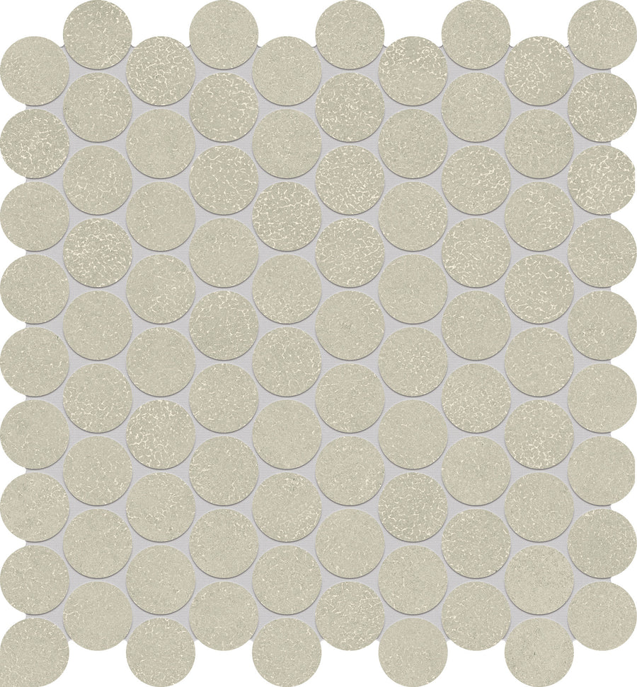 A grid of evenly spaced Avanti 1" Pennyround Porcelain Tiles in textured light beige forms circular rows on a light gray background, creating a uniform pattern with a calming aesthetic.