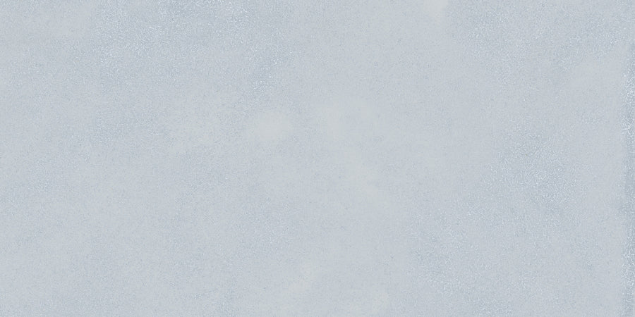 Light gray surface with a slightly rough texture and subtle speckles, delivering a calming look inspired by the elegant Avanti 12x24 Rectified Glazed Porcelain Tile.