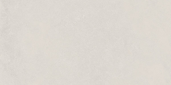The Avanti 12x24 Rectified Glazed Porcelain Tile features a seamless light gray concrete look with a subtle speckled surface, providing a smooth, neutral aesthetic ideal for elegant, calming interiors.