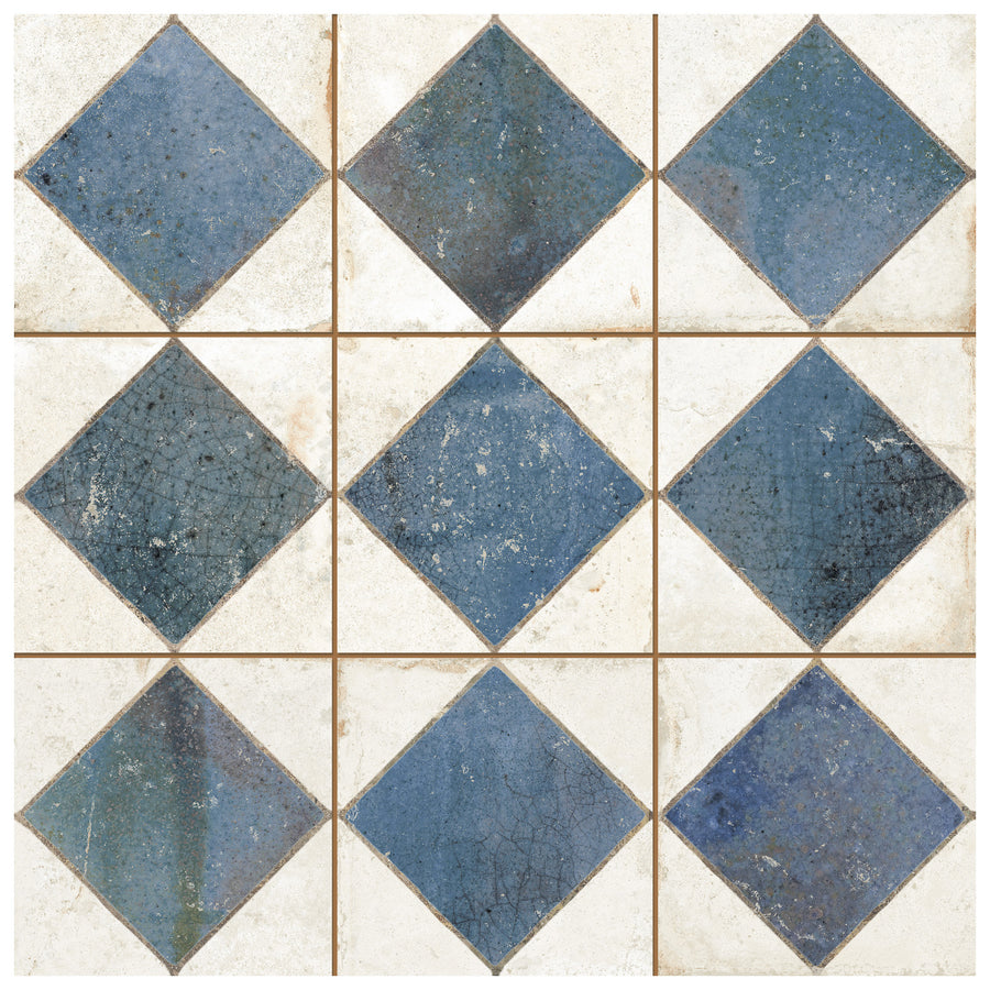 The Checkmate 13x13 Ceramic Tile displays a geometric pattern with alternating blue diamonds and white squares, separated by thin brown grout lines for a clean, grid-like checkerboard effect.