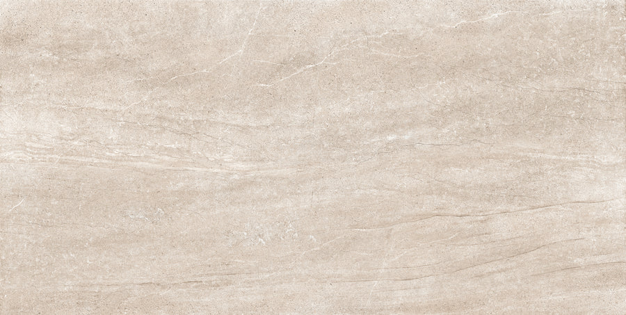 Rectangular sand-colored Santorini 12x24 Porcelain Tile with faint veining and a tactile elegance that highlights its stone-like texture.