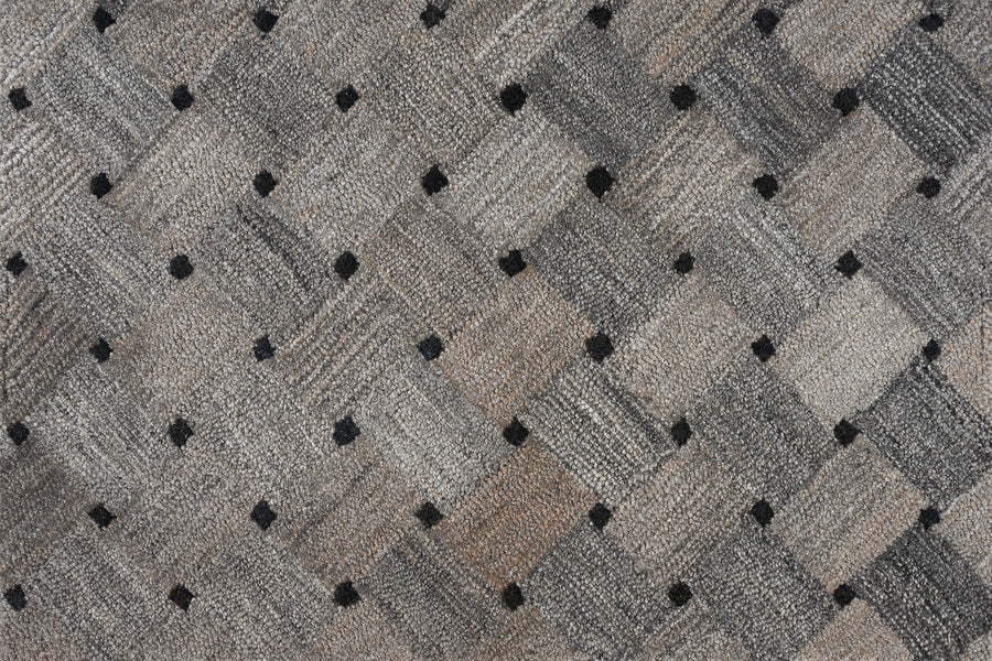 Close-up of Atrium On Trend Carpet in Bark, showing its textured gray and beige woven pattern with small black dots—ideal for adding a contemporary touch to any space.
