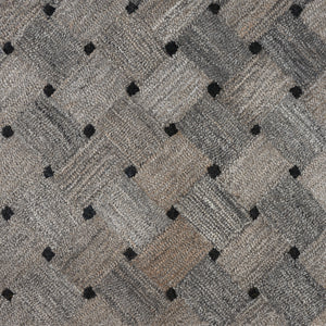 Close-up of Atrium On Trend Carpet in Bark, showing its textured gray and beige woven pattern with small black dots—ideal for adding a contemporary touch to any space.