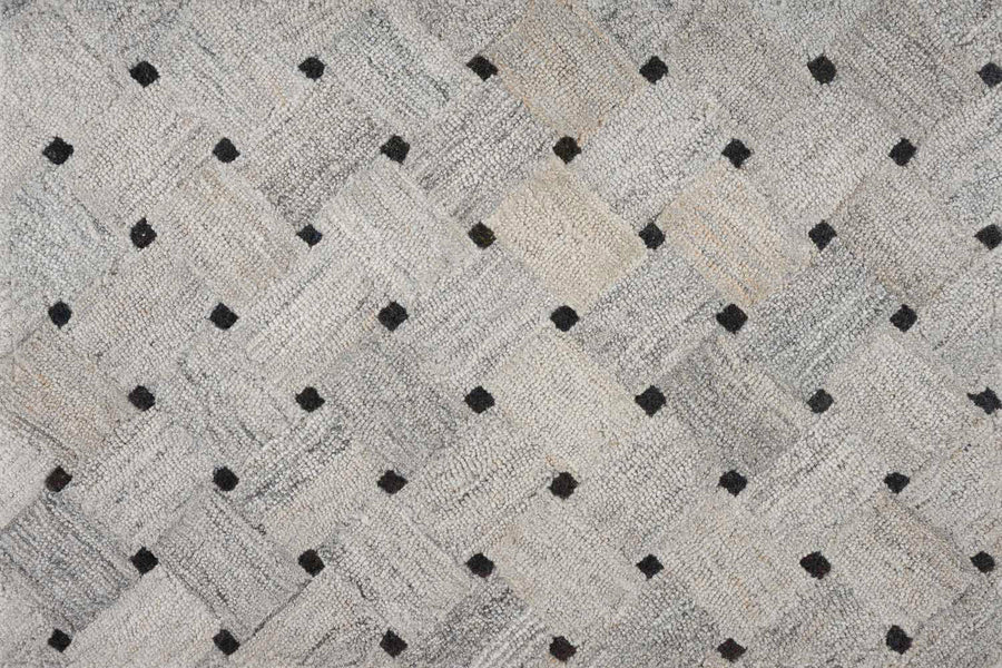 The Atrium On Trend Carpet in Stone features a woven basket-like texture with evenly spaced black square dots, providing durable and stylish flooring for any contemporary setting.