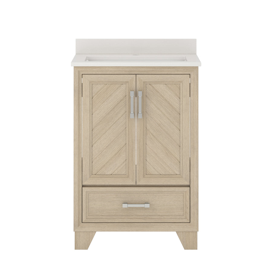A light wood bathroom vanity with a white countertop, two paneled cabinet doors with silver handles, and one drawer at the bottom with a matching silver handle.