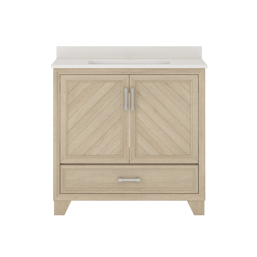 A light wood bathroom vanity with a white countertop, two cabinet doors featuring a chevron pattern, a wide drawer below, and modern silver handles, shown against a white background.