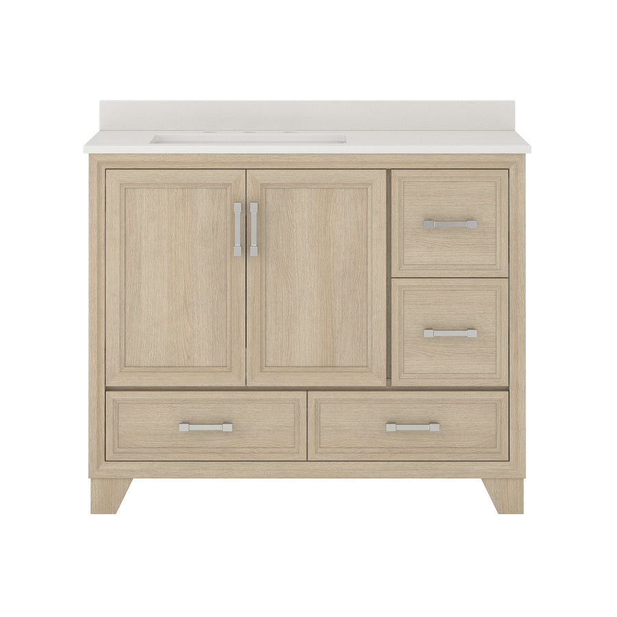 Light wood bathroom vanity with a white countertop, featuring two central cabinet doors, three drawers on the right side, and two drawers along the bottom, all with silver handles.