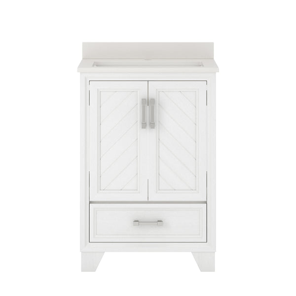 White bathroom vanity with chevron-patterned double doors, a single lower drawer with a handle, and a light-colored countertop. The design is modern and clean, featuring silver hardware.