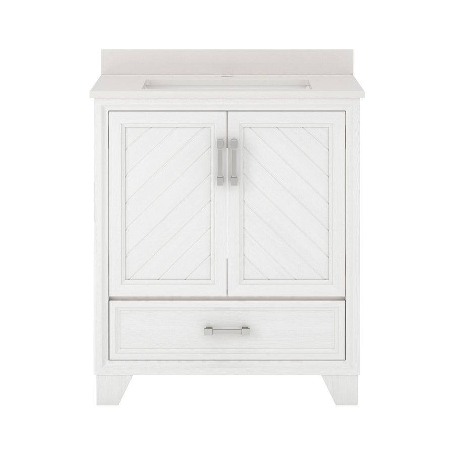 White bathroom vanity with two paneled doors featuring a chevron pattern, a rectangular drawer at the bottom, and silver handles. The countertop is smooth and integrated with a sink.