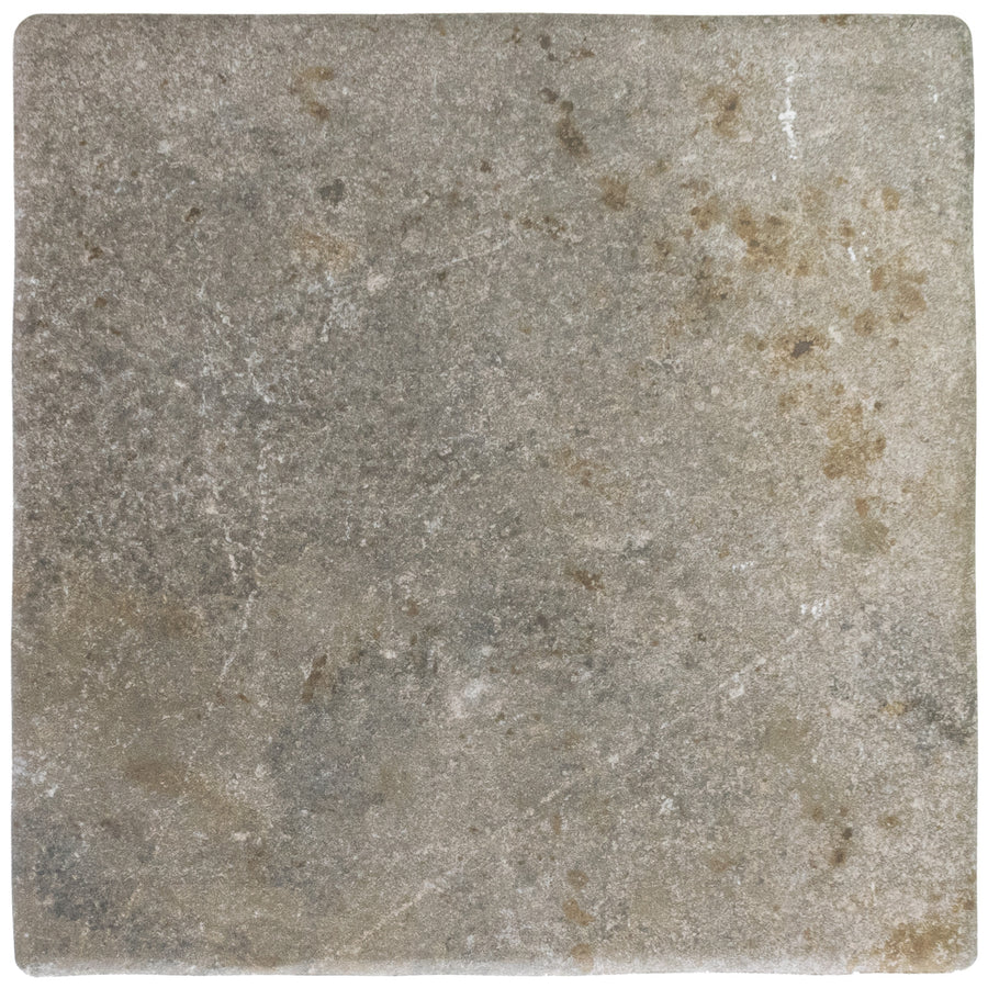 The Abbey Stone L 8.6" x 8.6" Ceramic Tile in Cluny features a square shape and weathered, textured surface with gray and brown tones, subtle variations, and natural imperfections for a minimalist look.