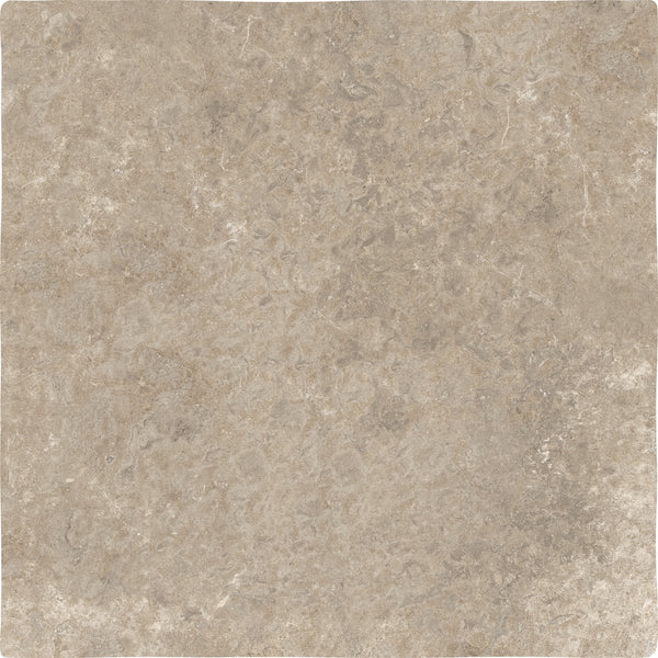 A close-up of the Abbey Stone XXL Ceramic Tile in Cluny color, showing its square shape and textured surface with natural beige tones and subtle variations in color and veining.