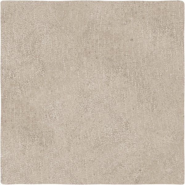 The Abbey Stone XXL Ceramic Tile in Rila features a square shape, beige color, textured speckled surface, and slightly uneven edges.