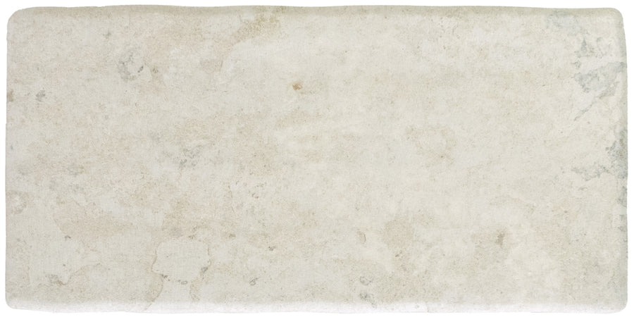 The Abbey Stone M 4.3" x 8.6" Ceramic Tile in Sintra features a rectangular shape, subtle texture, off-white color with gray and beige accents, and worn edges for a timeless, classic stone look reminiscent of traditional ceramic styles.