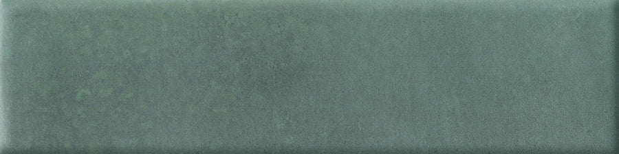 The Abode 2.5x9.5 Porcelain Tile features a velvety matte surface in a muted, mottled green shade—perfect for accent features.