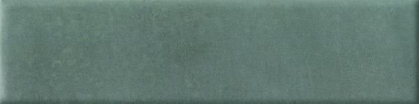 The Abode 2.5x9.5 Porcelain Tile features a velvety matte surface in a muted, mottled green shade—perfect for accent features.
