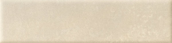The Abode 2.5x9.5 Porcelain Tile features a rectangular, beige velvety finish with a smooth, slightly glossy surface and subtle cloudy patterns for a soft, natural look.