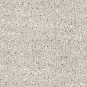 Close-up of Homage Berber Carpet in Abrash—light beige with a soft, textured surface and subtle grid pattern formed by small raised dots and lines. Its woven look is ideal for high-traffic areas.