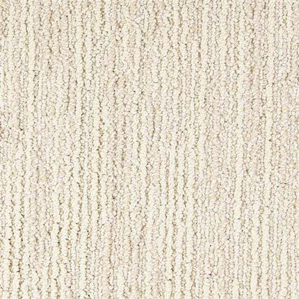 Close-up of Advocate Berber Carpet in Adore, featuring a light beige tone with vertical, evenly spaced lines and a soft, plush texture. The premium Berber weave offers durability and comfort.