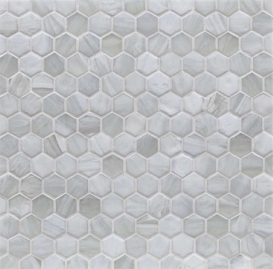 The Agate Hexagon Mosaic Glass Tile features white and light gray hexagons in a honeycomb pattern, offering a modern geometric surface design.