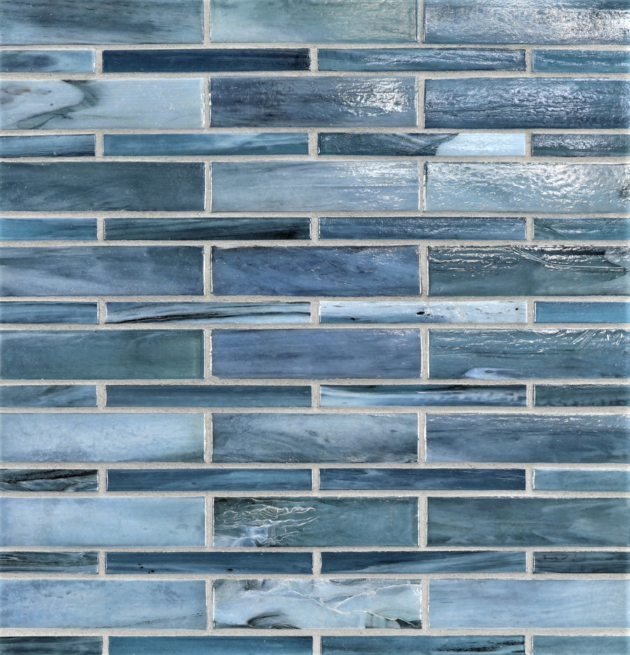 A close-up shows a wall featuring Agate Moyou Mosaic Glass Tile in a staggered brick pattern, displaying blue tones and subtle marbling.