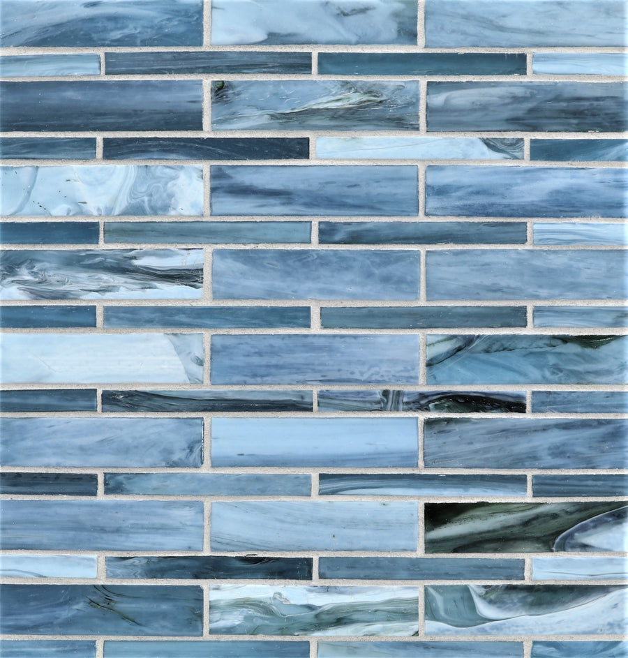Agate Moyou Mosaic Glass Tile features rectangular blue and white glass tiles in a horizontal brick pattern, showcasing a marbled texture with shades of blue, gray, and white.