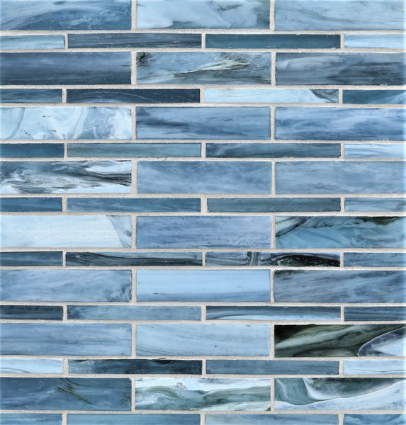 Agate Moyou Mosaic Glass Tile features rectangular blue and white glass tiles in a horizontal brick pattern, showcasing a marbled texture with shades of blue, gray, and white.