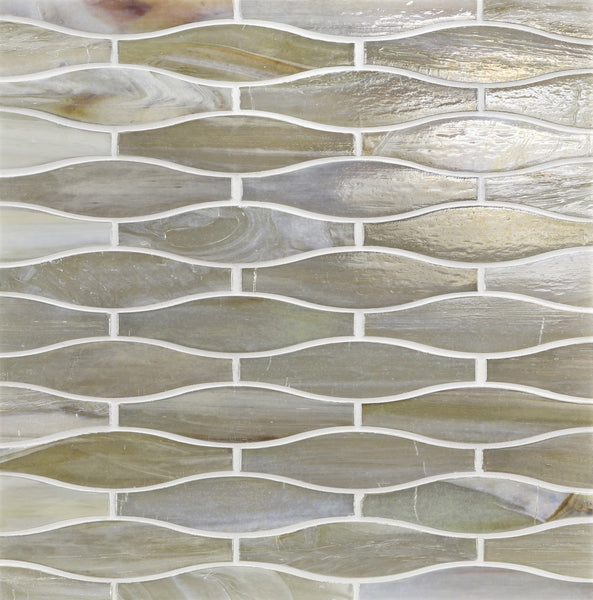 A close-up of Agate Taiko Mosaic Glass Tile showcases wavy, elongated tiles in neutral tones with white grout. The glossy, slightly iridescent three-dimensional glass surface adds depth and elegance to any space.
