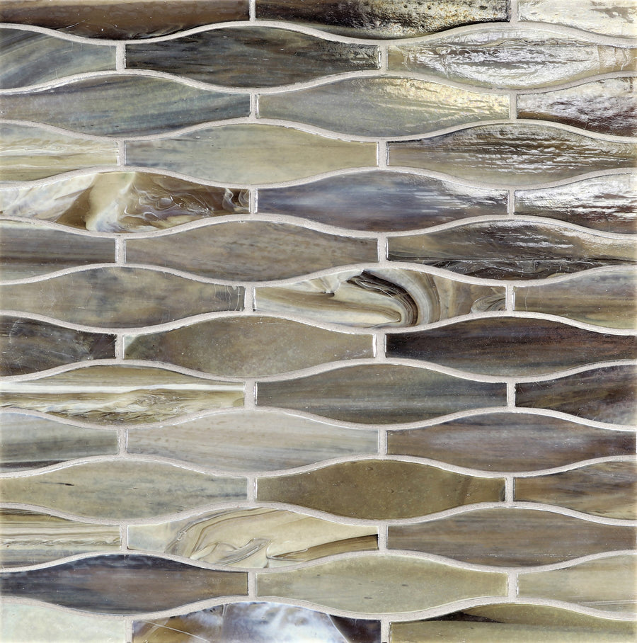 A close-up of Agate Taiko Mosaic Glass Tile, featuring three-dimensional glass mosaics in wavy patterns with brown, beige, and gray tones and a glossy finish.