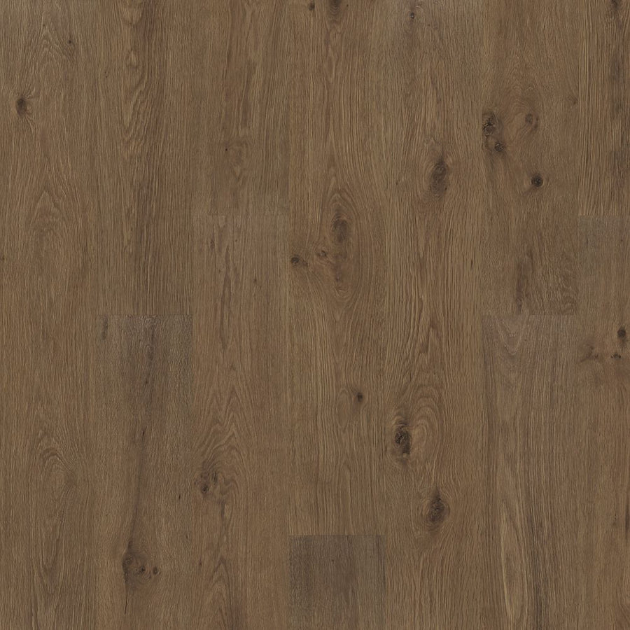 Close-up of Woodland Resort 8 11/32" Vinyl Plank flooring, featuring a natural wood grain pattern with knots and textured, rustic details. The image highlights the rich shades and markings of this high-quality vinyl plank.