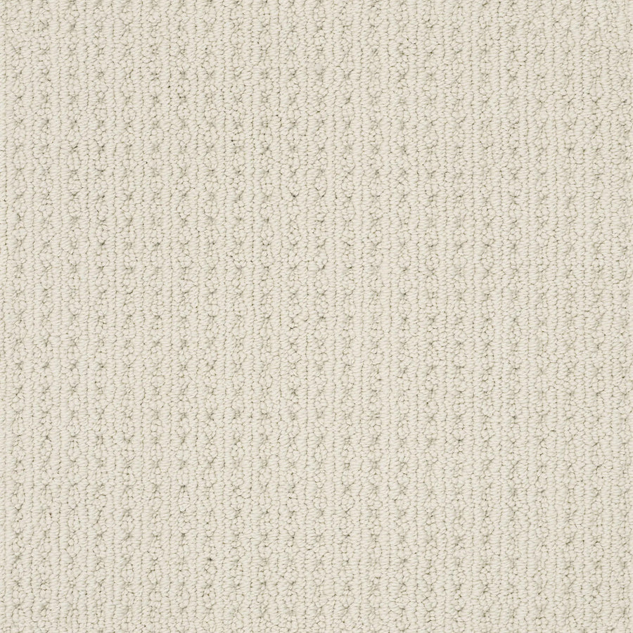 Close-up of San Lucas Family Friendly Carpet in Aged White—a light beige, textured carpet with a subtle vertical line pattern and small raised loops. Durable and soft, it's ideal for high-traffic homes.
