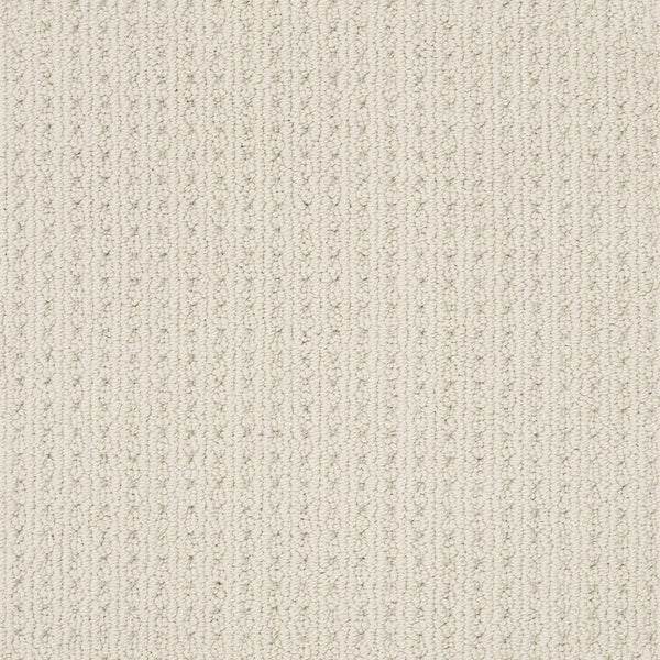 Close-up of San Lucas Family Friendly Carpet in Aged White—a light beige, textured carpet with a subtle vertical line pattern and small raised loops. Durable and soft, it's ideal for high-traffic homes.