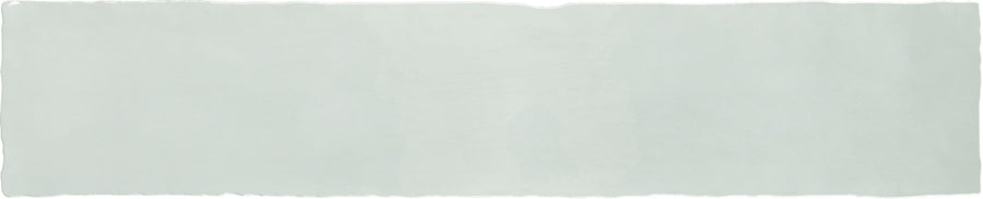 Aire 2x10 Glazed Ceramic Subway Tile: A long, light gray tile with slightly wavy, uneven edges on top and bottom, evoking the handcrafted look of traditional subway tiles. Background is plain and unmarked.