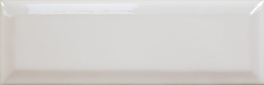 The Alchemist Bevel 2" x 6" Subway Tile in Silk is a glossy, rectangular tile with a smooth, reflective surface and slightly beveled edges.