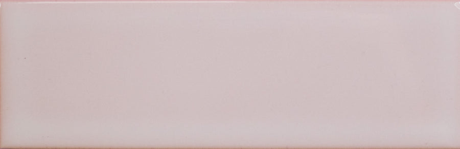 The Alchemist 2" x 6" Subway Tile in Primrose features a smooth, glossy finish, slightly rounded edges, and a subtle gradient—ideal for kitchen backsplashes or accent walls.