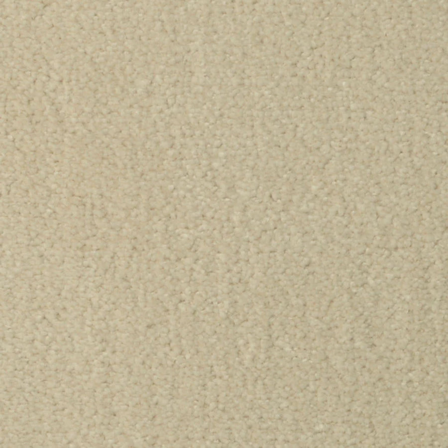 A close-up of Seduction On Trend Carpet in Antique White shows its light beige, densely packed, and slightly fuzzy fibers—creating a cozy, neutral look that adds comfort and style to any room.