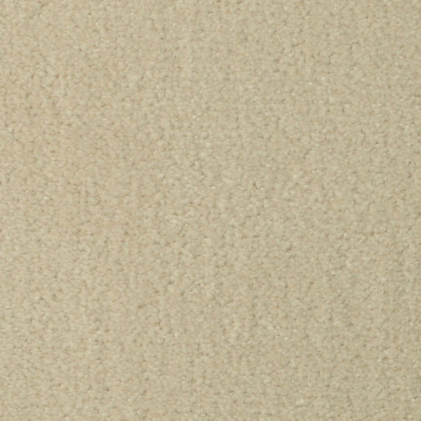 A close-up of Seduction On Trend Carpet in Antique White shows its light beige, densely packed, and slightly fuzzy fibers—creating a cozy, neutral look that adds comfort and style to any room.