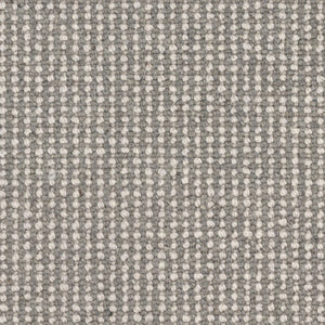 Close-up of Andros Berber Carpet in Antiquity color, featuring a grid-like pattern of small, raised off-white dots on a gray background for a uniform, tightly woven, and durable surface.