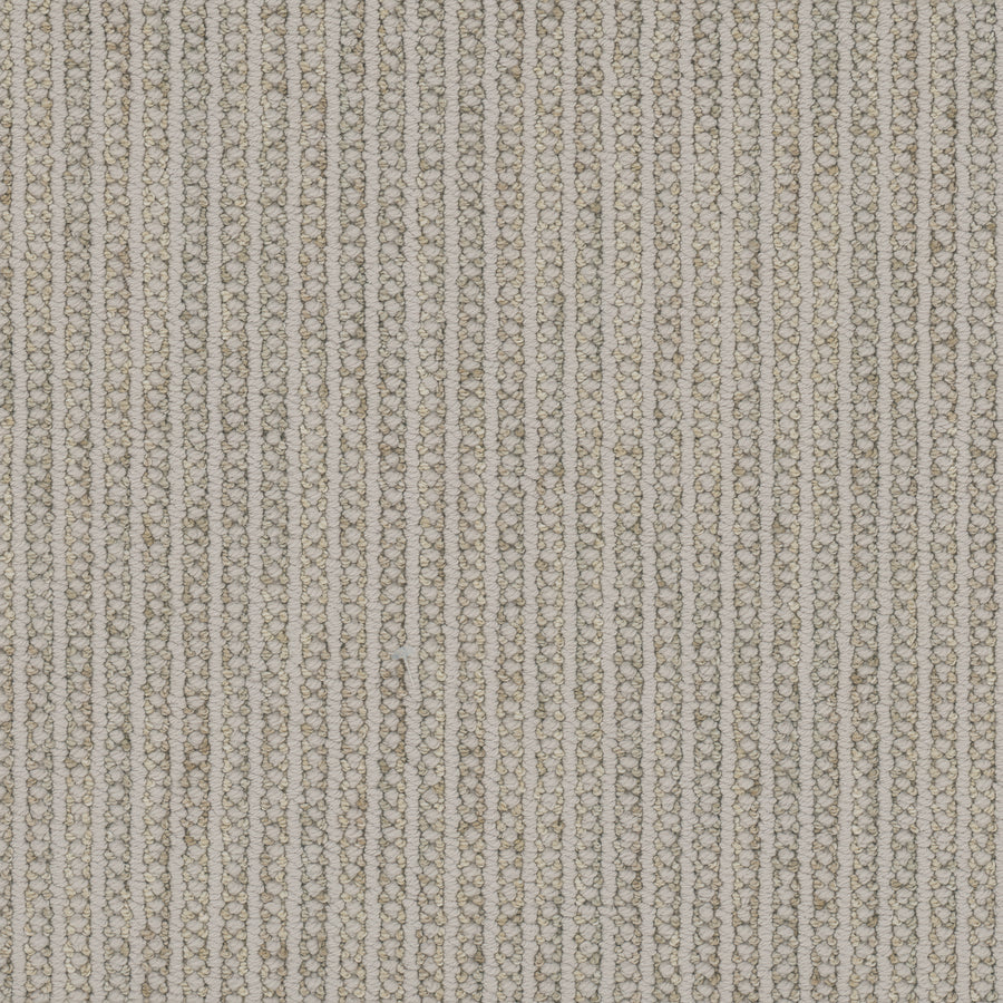 Close-up of the Appealing Berber Carpet featuring vertical rows of tightly woven beige and off-white threads, forming a textured, ribbed striped pattern.