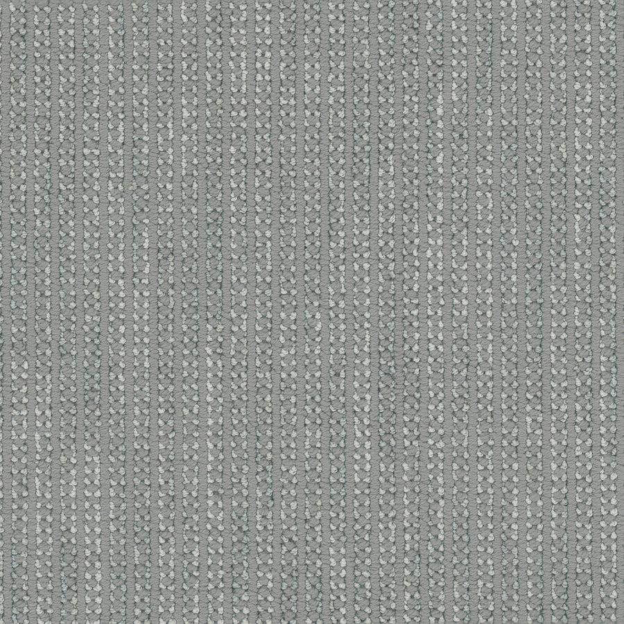 Appealing Berber Carpet features textured grey fabric with vertical rows of small, light-colored dots creating a subtle geometric pattern, delivering the soft, modern look of an elegant carpet.