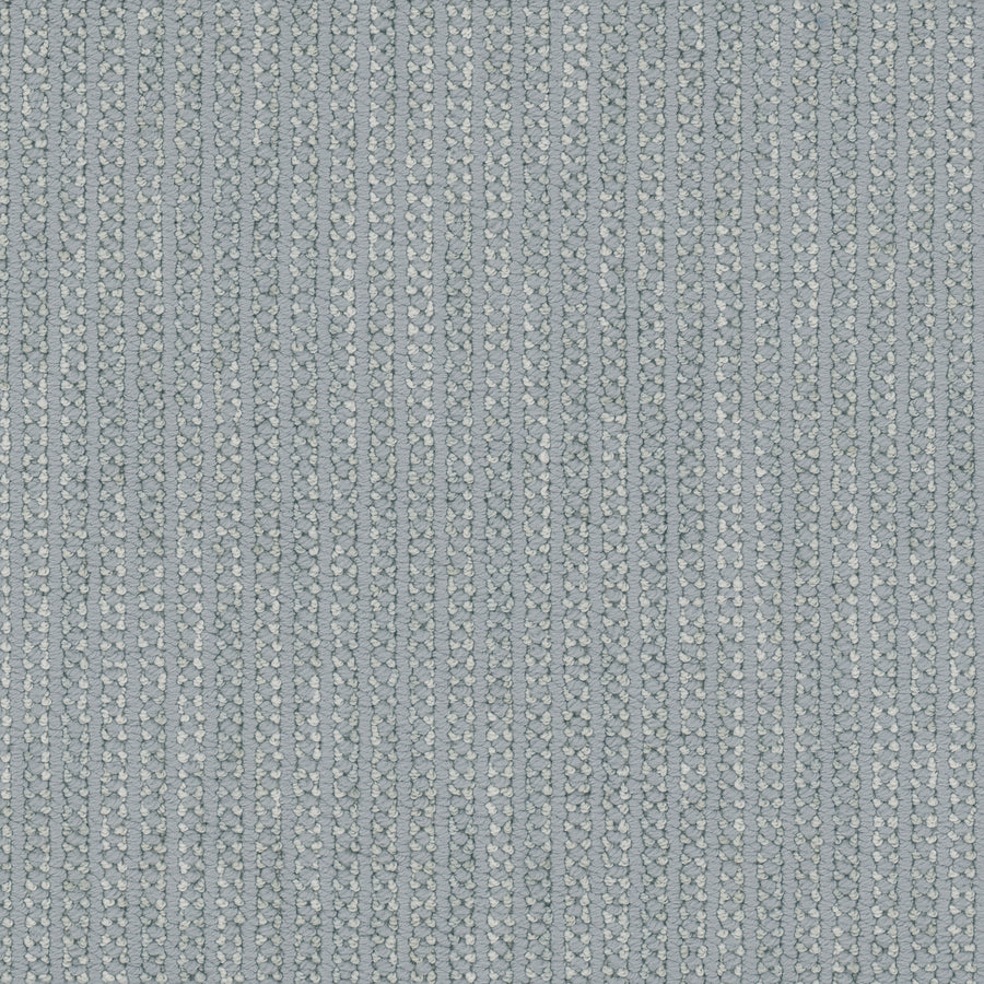 Close-up of Appealing Berber Carpet: textured light blue woven fabric with a repeating vertical pattern of small, raised ovals and thin lines, offering a soft, uniform look and the subtle sophistication of elegant carpeting.