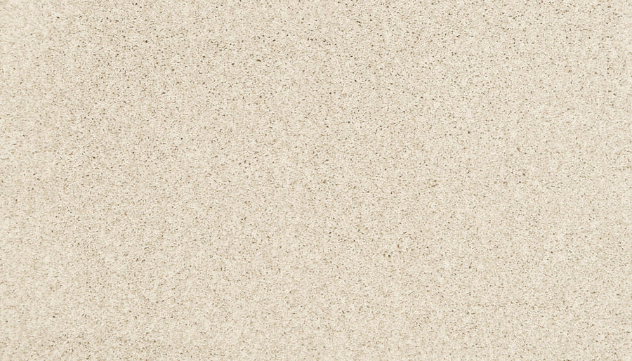 Close-up view of the Artisan Elements Family Friendly Carpet in Creamer. Its smooth, fine, uniform grains resemble soft beach sand, making it perfect for high-traffic areas with comfort and subtle natural color variations.