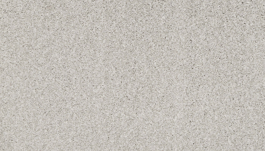 A close-up view of the Artisan Elements Family Friendly Carpet in Winter color, featuring a light gray tone with a textured finish and subtle specks—perfect for high-traffic spaces needing both durability and style.