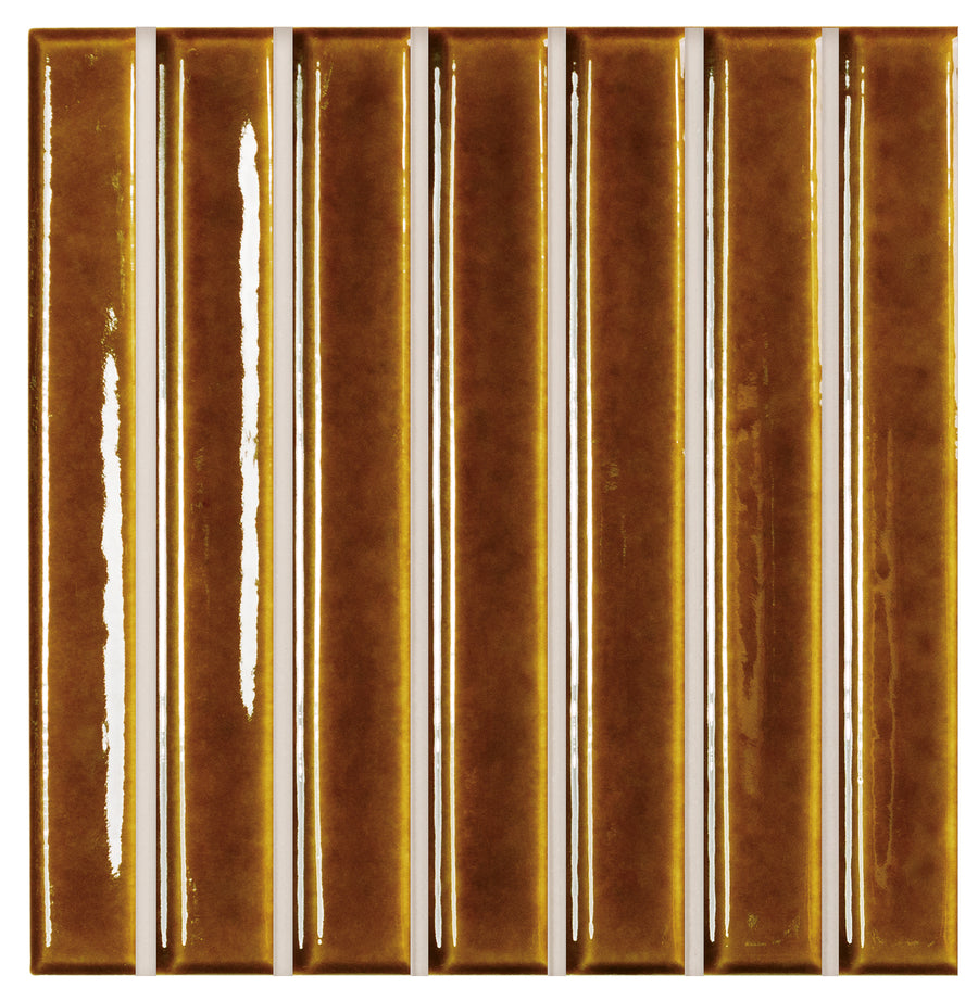 A close-up of the Astria 4.6" x 4.6" Deco Ceramic Tile in Honey Glossy, featuring vertical tiles with narrow white grout lines—perfect for backsplashes or accent walls.