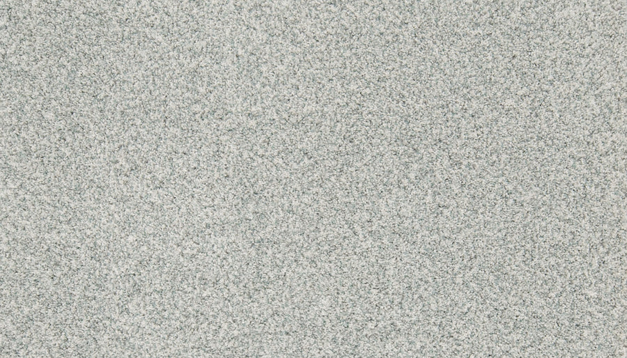 Close-up of Aurora Lights Family Friendly Carpet in light gray, featuring a textured, speckled pattern with small flecks—an elegant, durable option for luxury home interiors.