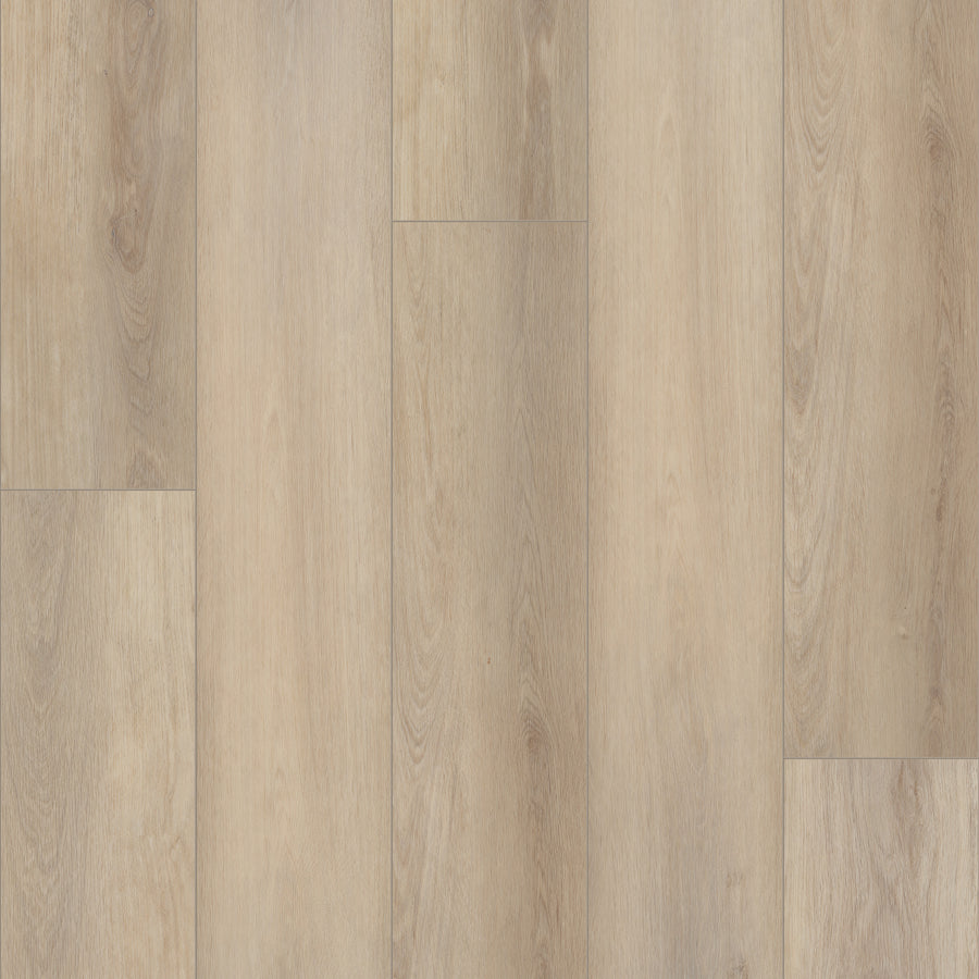Coretec Plus Enhanced Vinyl features a light wood look with visible grain in a staggered plank layout. Its smooth, clean surface and natural appearance make it a versatile and stylish option for many interior designs.