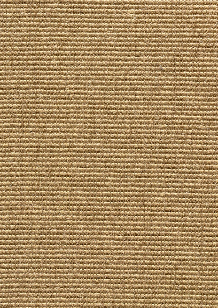 Close-up of Cyprus Berber Carpet in Autumn color, displaying a grid-like pattern of tightly woven threads. The textured, sturdy surface makes it ideal for durable flooring and heavy-duty use.