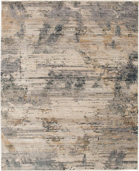 The Echo Area Rug is a rectangular abstract rug with soft beige, gray, blue, and brown tones in a contemporary weathered pattern featuring irregular streaks and ornamental patches.