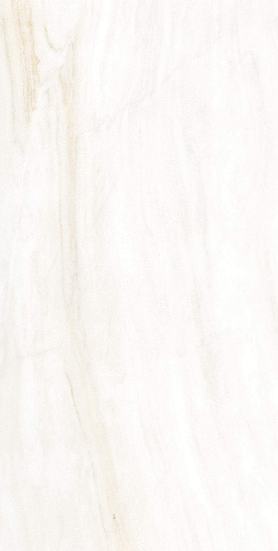 A close-up view of a white marble surface with subtle beige and light brown veining patterns running diagonally across the stone.