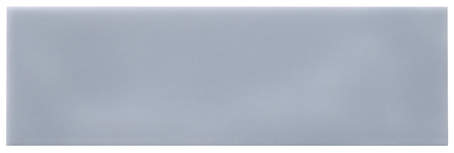 The Zephyr 2.5x8 Ceramic Tile features a smooth, glossy finish in solid light gray—ideal for Mediterranean-inspired interiors. Special order available.